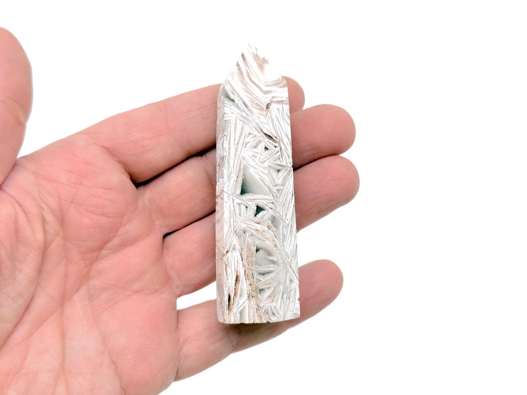 Mexican White Agate obelisk tower crystal from GemstoneGO, showcasing smooth, polished white and beige stone with natural banding.