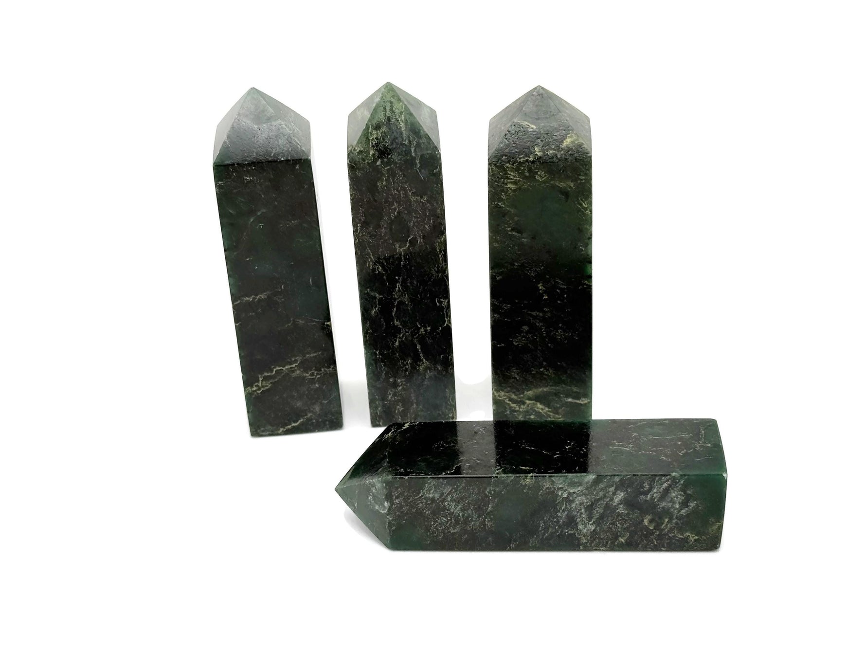 Emerald Quartz obelisk tower crystal from GemstoneGO, with a polished green quartz gemstone in a tall, pointed obelisk shape.