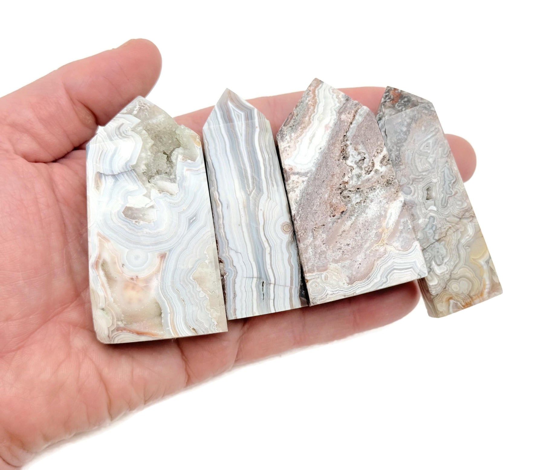 Crazy Lace Agate obelisk tower crystal from GemstoneGO, featuring vibrant colorful banding and polished gemstone surface.