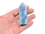 Blue coral obelisk tower crystal from GemstoneGO, showing a polished blue coral gemstone in a tall, tapered obelisk shape.