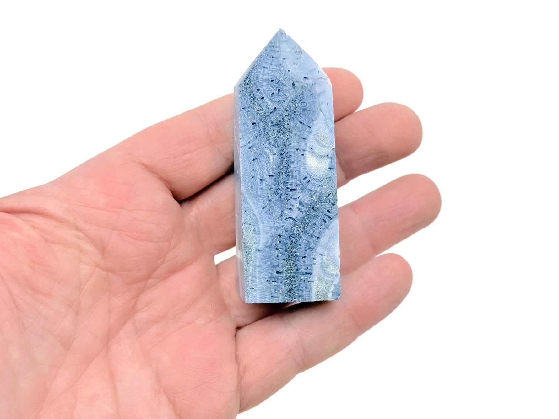 Blue coral obelisk tower crystal from GemstoneGO, showing a polished blue coral gemstone in a tall, tapered obelisk shape.