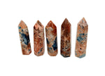 Sunstone and Blue Apatite obelisk tower crystal from GemstoneGO, showcasing vibrant orange and blue mineral formations.