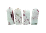Pink tourmaline obelisk tower crystal from GemstoneGO, showcasing a polished pink gemstone with natural striations.