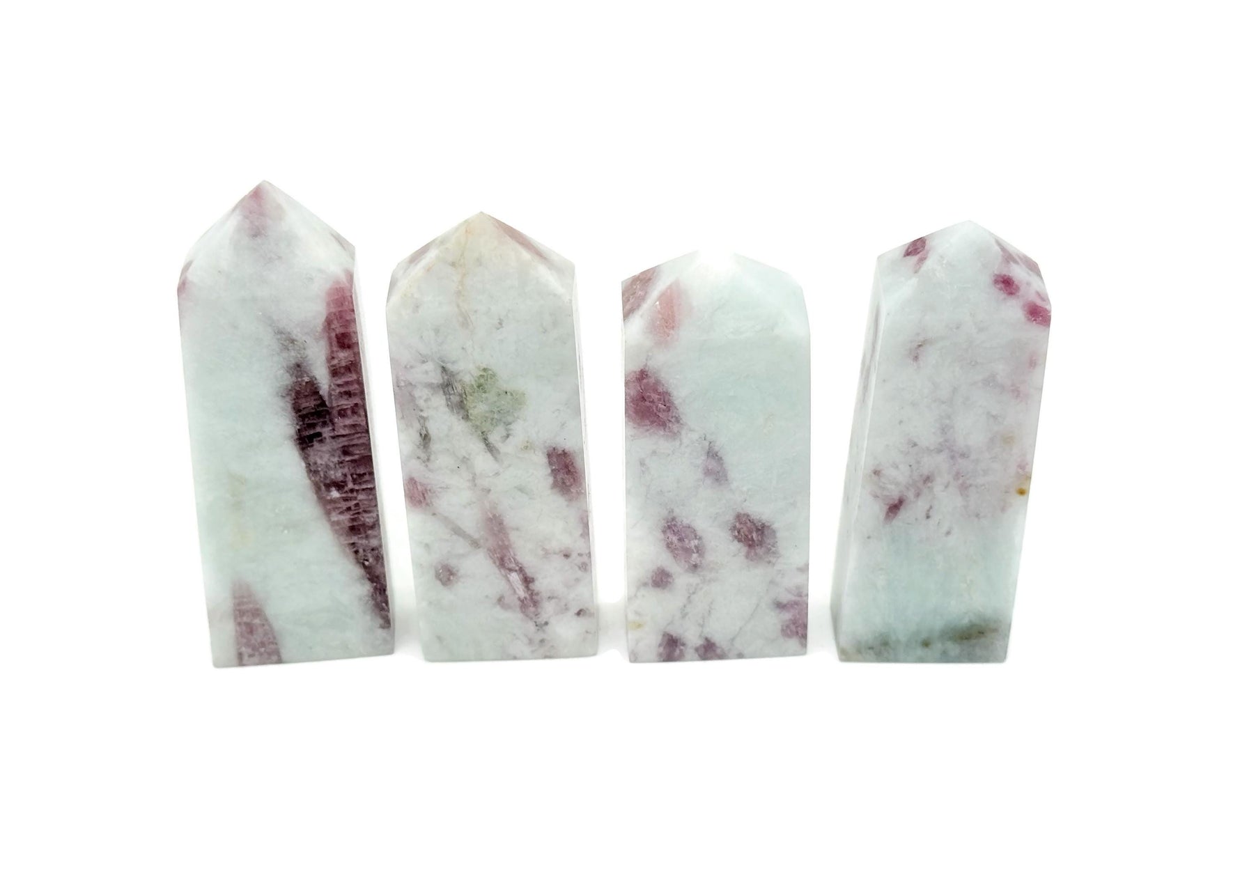 Pink tourmaline obelisk tower crystal from GemstoneGO, showcasing a polished pink gemstone with natural striations.