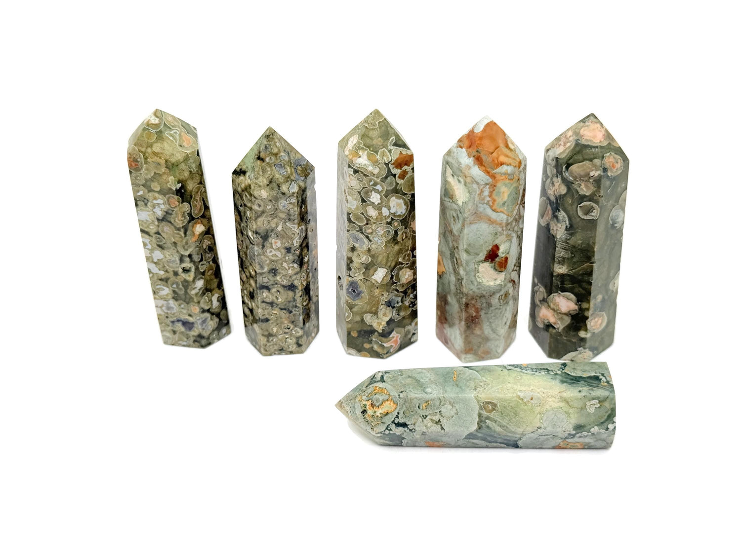 Rhyolite Obelisk Tower crystal from GemstoneGO featuring a rainforest green hue and polished gemstone surface.