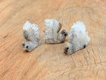 Squirrel-shaped quartz gemstone carving by GemstoneGO, detailed squirrel design in polished clear quartz stone.