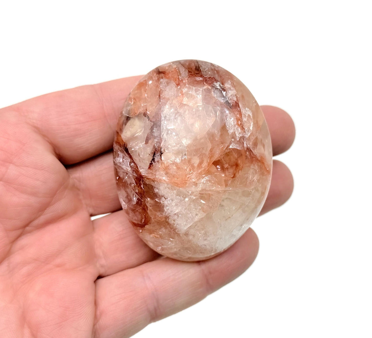 Red Hematoid Quartz Fire Quartz palm gemstone, spa stone, and healer's crystal from GemstoneGO, showcasing vibrant red and clear quartz.