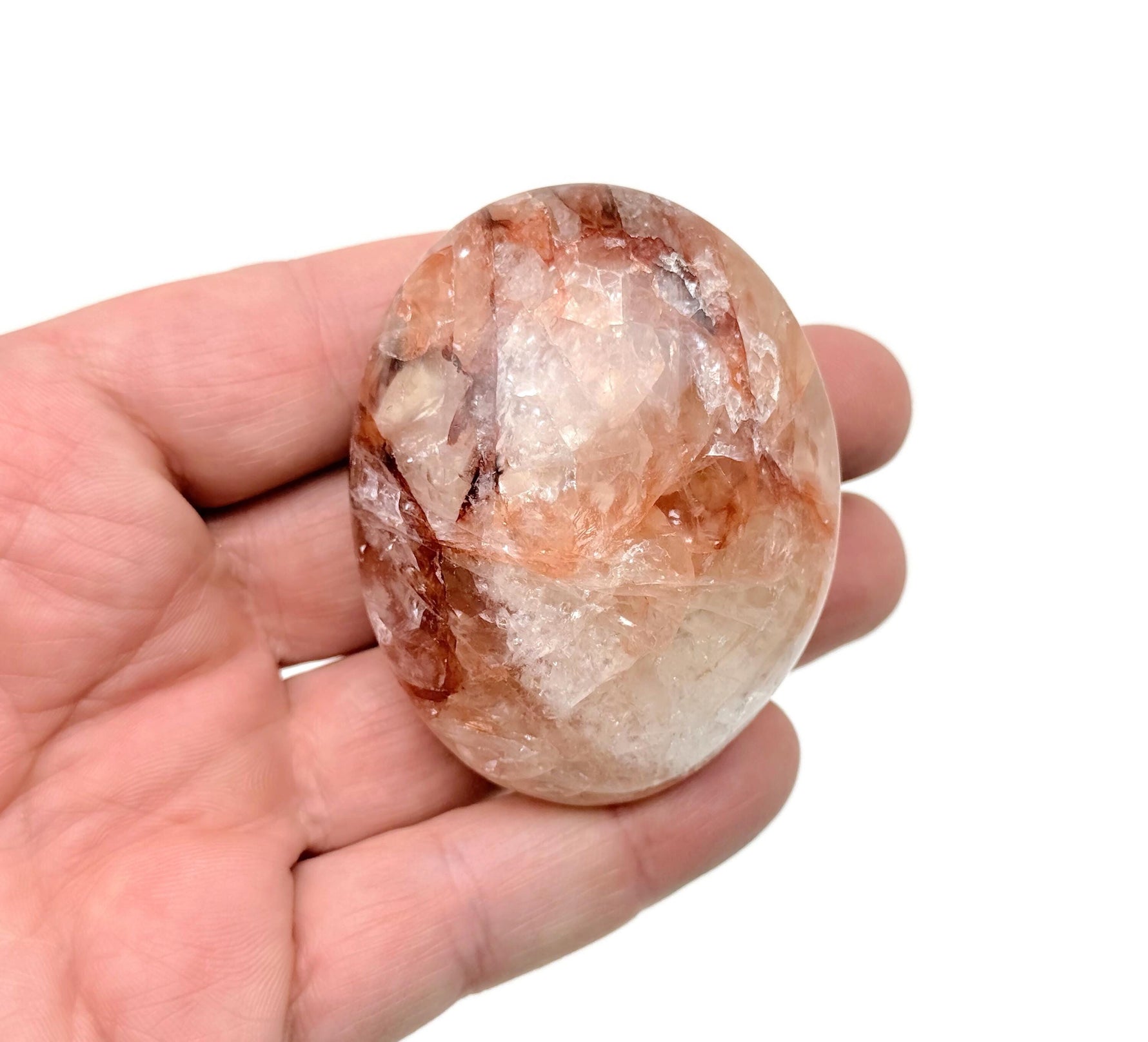 Red Hematoid Quartz Fire Quartz palm gemstone, spa stone, and healer's crystal from GemstoneGO, showcasing vibrant red and clear quartz.