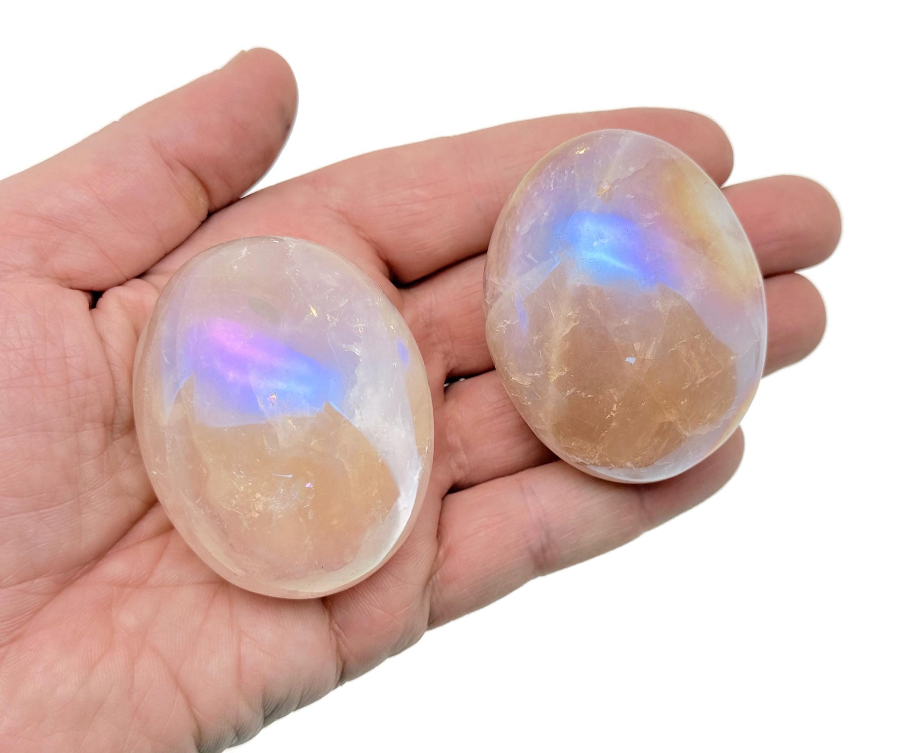 Angel Aura Quartz palm gemstone spa stone by GemstoneGO, showcasing iridescent, polished angel aura quartz in a smooth palm-sized form.