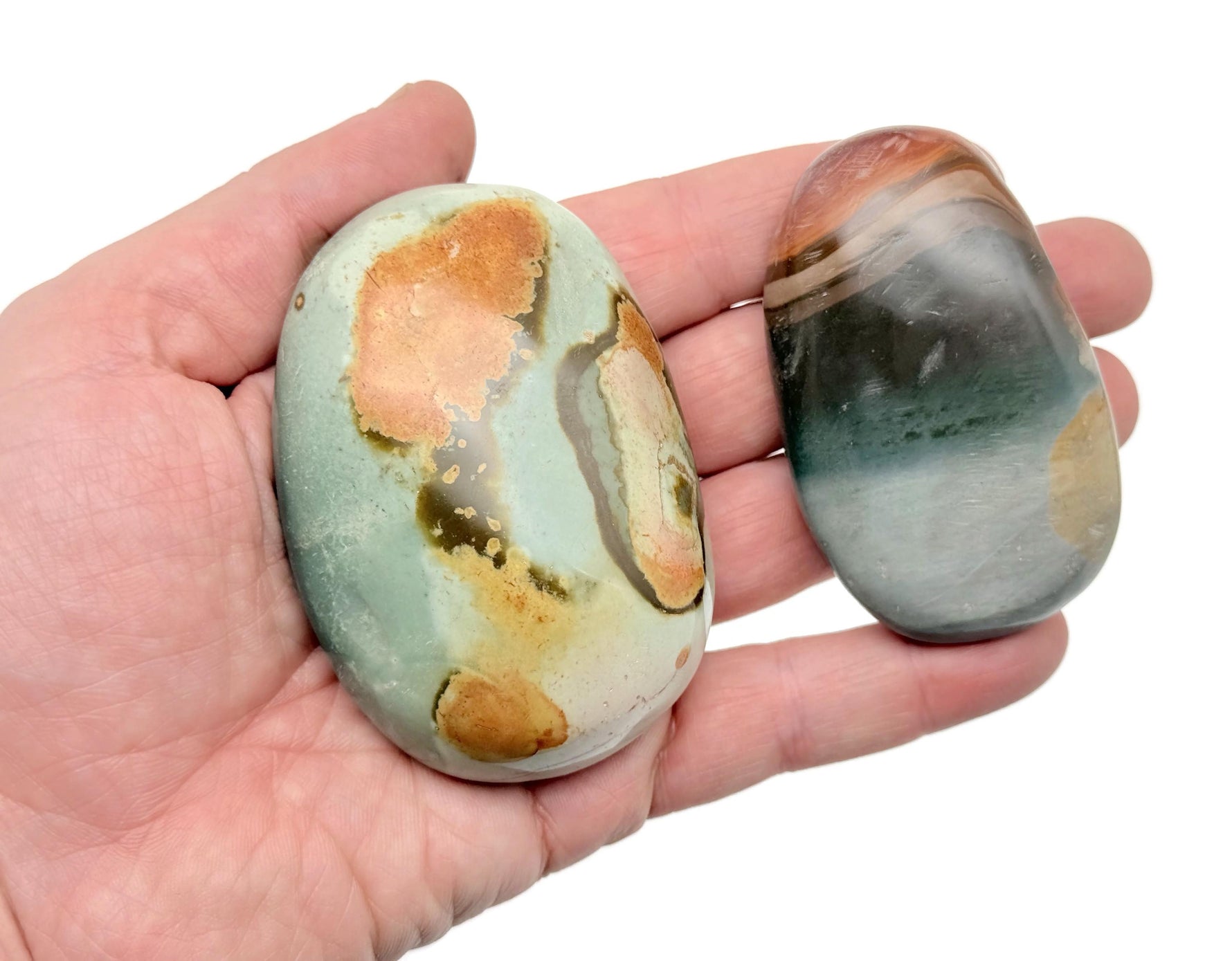 Ocean Jasper palm gemstone spa stone from GemstoneGO, smooth round stone with colorful patterns for relaxation or massage.