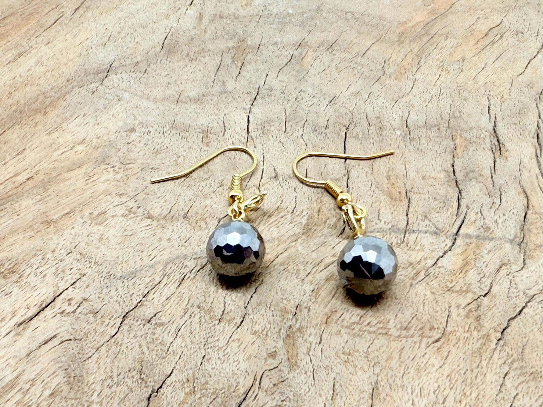 Gold Terahertz Ball Crystal Earrings with intricate gemstone design, perfect for gifting or stylish wear.