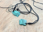 Malachite crystal necklace with adjustable cord from GemstoneGO, featuring a polished green stone pendant on a black cord.