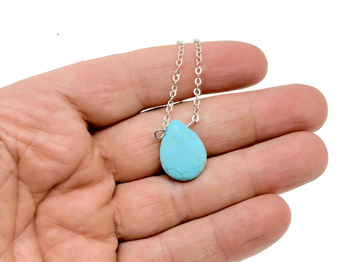 Turquoise synthetic necklace from GemstoneGO featuring beads designed for protection and balance, shown in close-up.