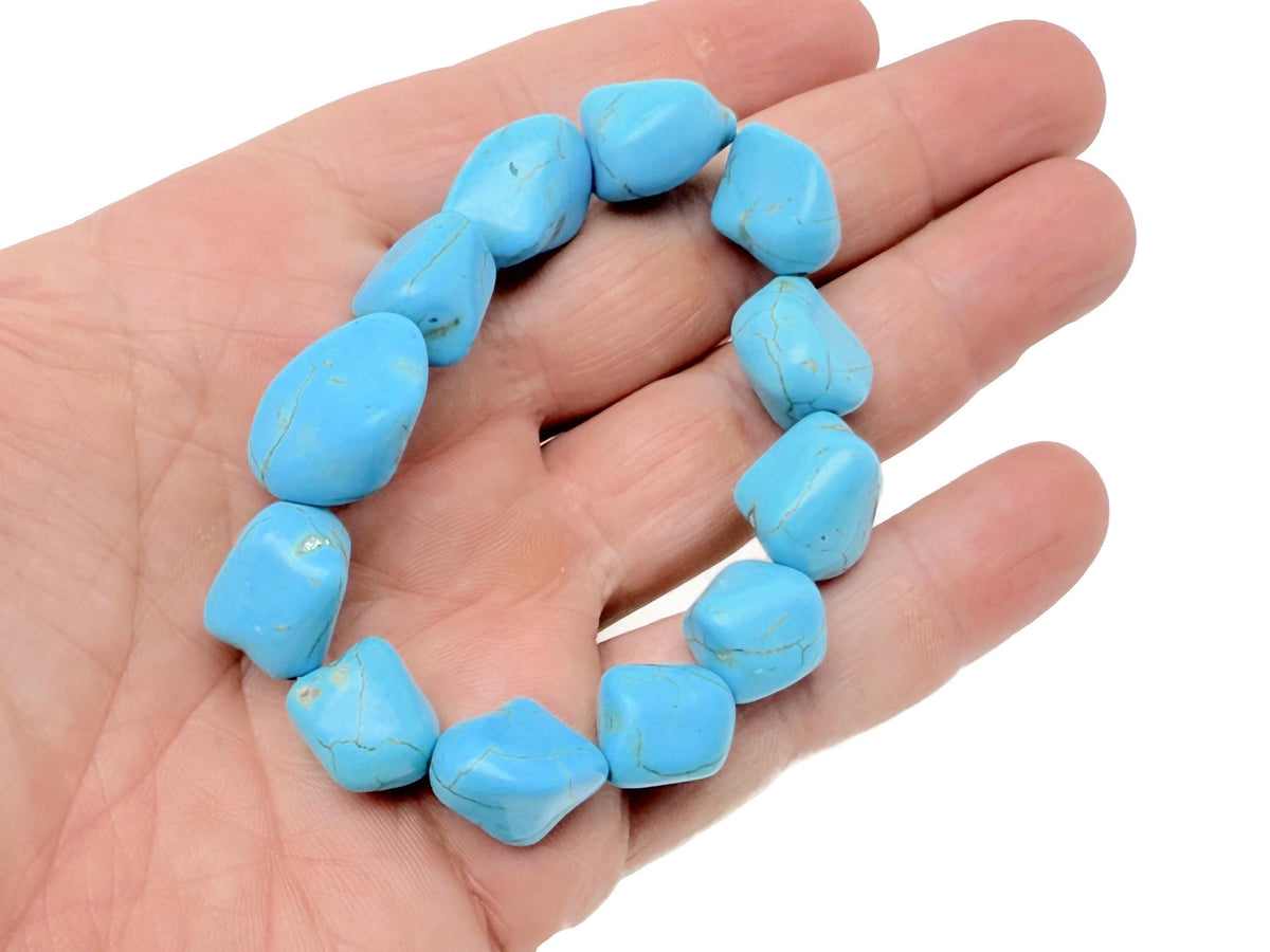 Turquoise jewelry set with crystals from GemstoneGO, featuring a necklace and matching earrings on a white background.