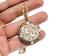 Pearl and crystal flower jewelry set by GemstoneGO featuring earrings and necklace with elegant floral design.
