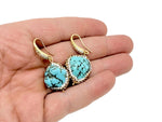 Turquoise jewelry set with crystal accents, featuring necklace and earrings, by GemstoneGO. Elegant and vibrant turquoise jewelry ensemble.