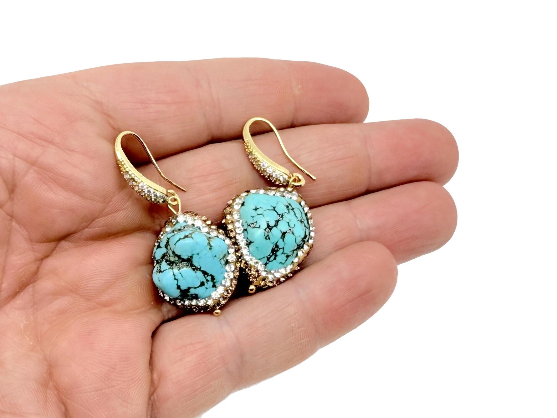 Turquoise jewelry set with crystal accents, featuring necklace and earrings, by GemstoneGO. Elegant and vibrant turquoise jewelry ensemble.