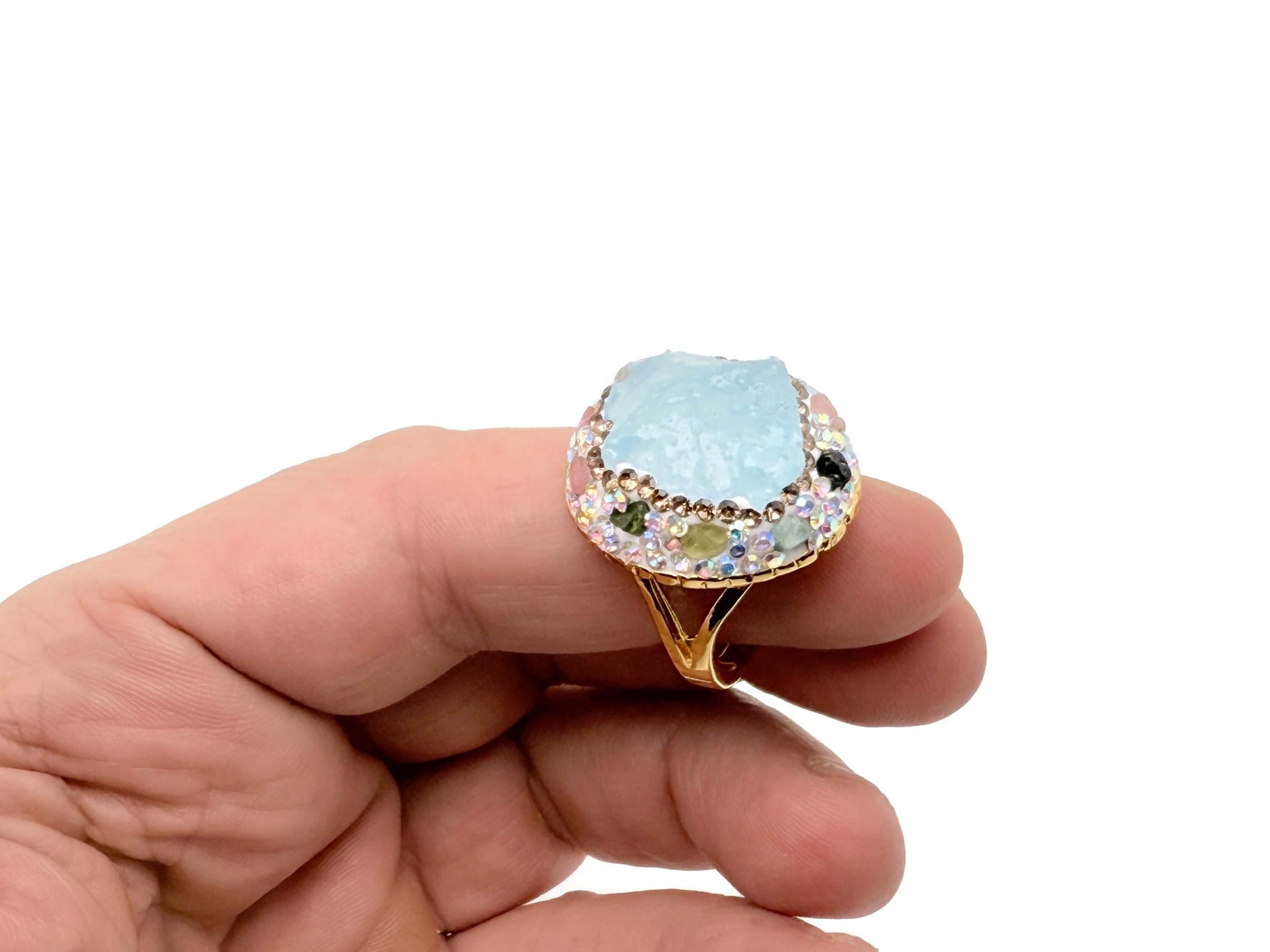 Handmade aquamarine jewelry set featuring boho chic design with gemstone accents, displayed on a neutral background.