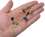 Dainty gemstone gold wire rings featuring natural crystal stones, showcasing a mix of colorful, handcrafted gemstone jewelry by GemstoneGO.