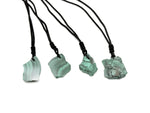 Malachite crystal necklace with adjustable cord from GemstoneGO, featuring a polished green gemstone pendant on a black cord.