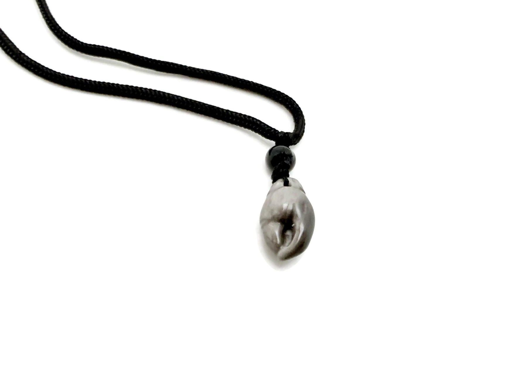Silver obsidian crab claw necklace with crystal accents from GemstoneGO, showcasing detailed craftsmanship and polished metallic finish.