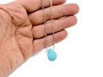 Turquoise synthetic necklace from GemstoneGO featuring a beaded design for protection and balance, displayed on a neutral background.
