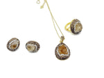 Citrine crystal jewelry set by GemstoneGO featuring a necklace and earrings with vibrant orange citrine stones and silver settings.