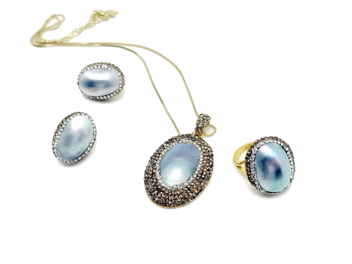 Elegant blue pearl jewelry set by GemstoneGO, featuring a necklace and earrings for bridal or evening wear.