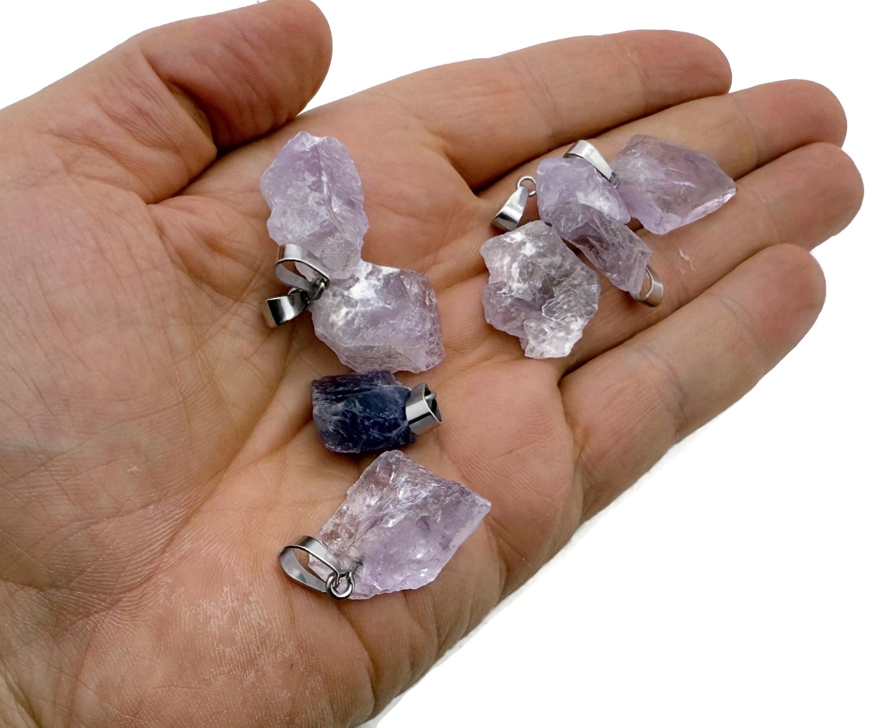 Amethyst crystal pendant from GemstoneGO, showcasing a polished purple gemstone with silver bail for jewelry making.