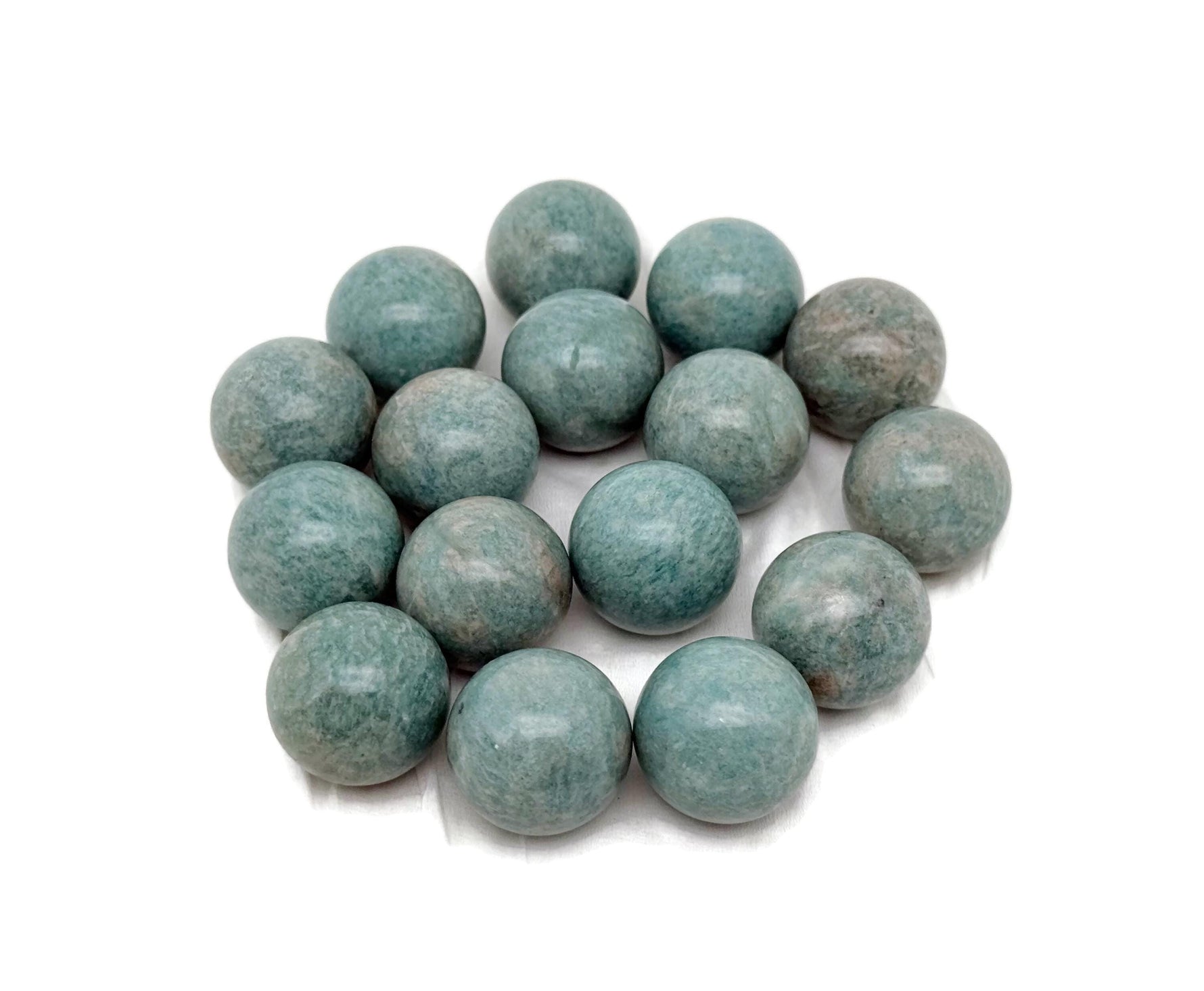 20mm Amazonite sphere gemstone by GemstoneGO, showcasing its smooth, polished crystal ball with blue-green mineral patterns.