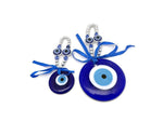 Blue glass Turkish evil eye charm with intricate design, believed to protect and bring good luck, ideal as a healing gift or home decor.