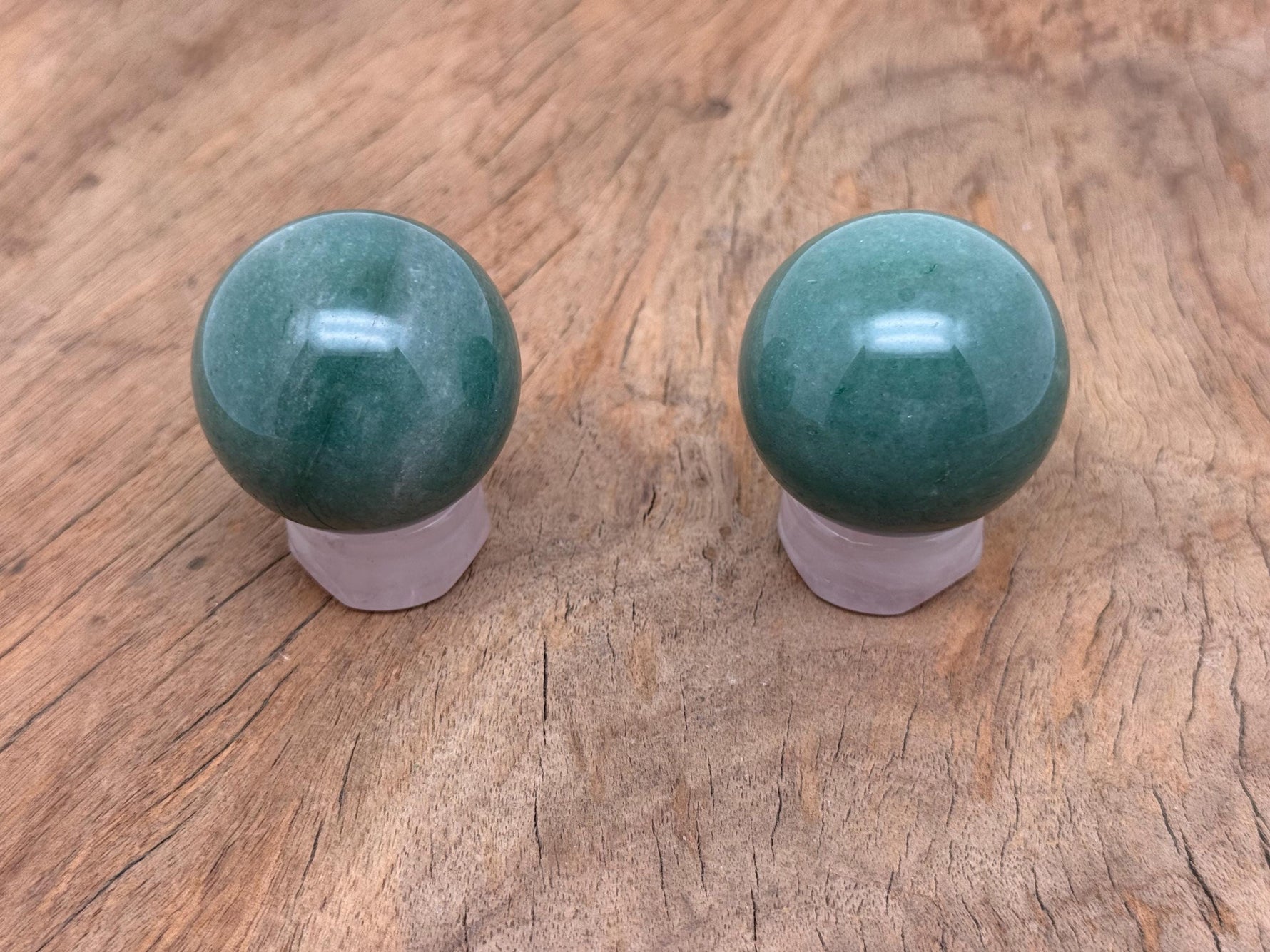 Aventurine gemstone sphere, 40-50mm crystal ball from GemstoneGO, smooth green stone with natural patterns and polished surface.