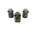 Handcrafted Labradorite frog gemstone sculpture with iridescent colors, detailed creature carving, and natural stone textures.