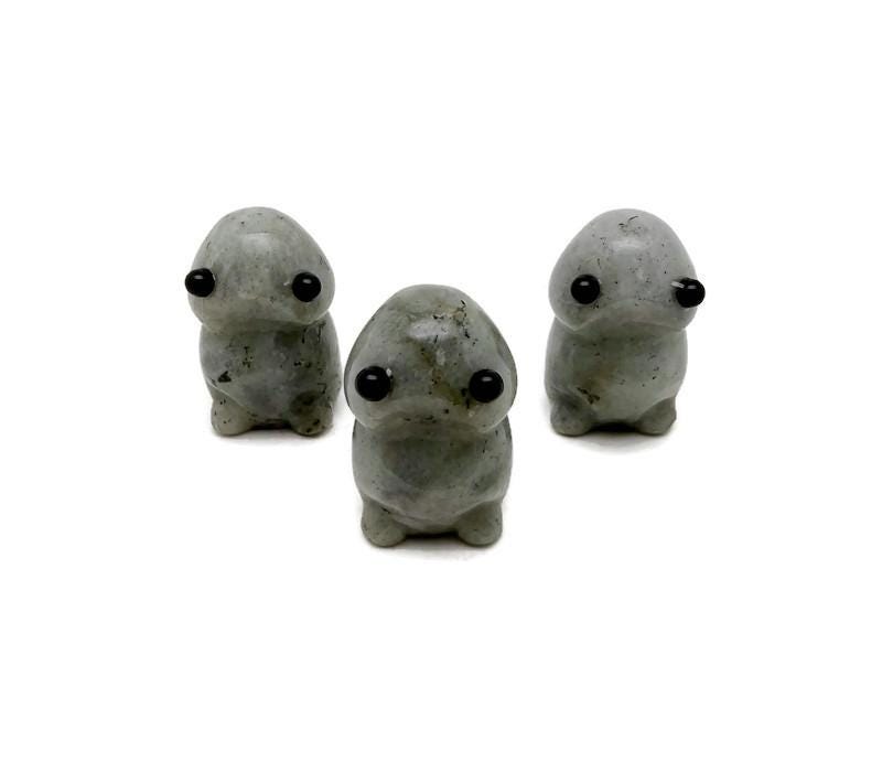 Handcrafted Labradorite frog gemstone sculpture with iridescent colors, detailed creature carving, and natural stone textures.