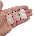 Handcrafted rose quartz frog monster crystal carving with detailed gemstone features, showcasing a unique gemstone creature statue.