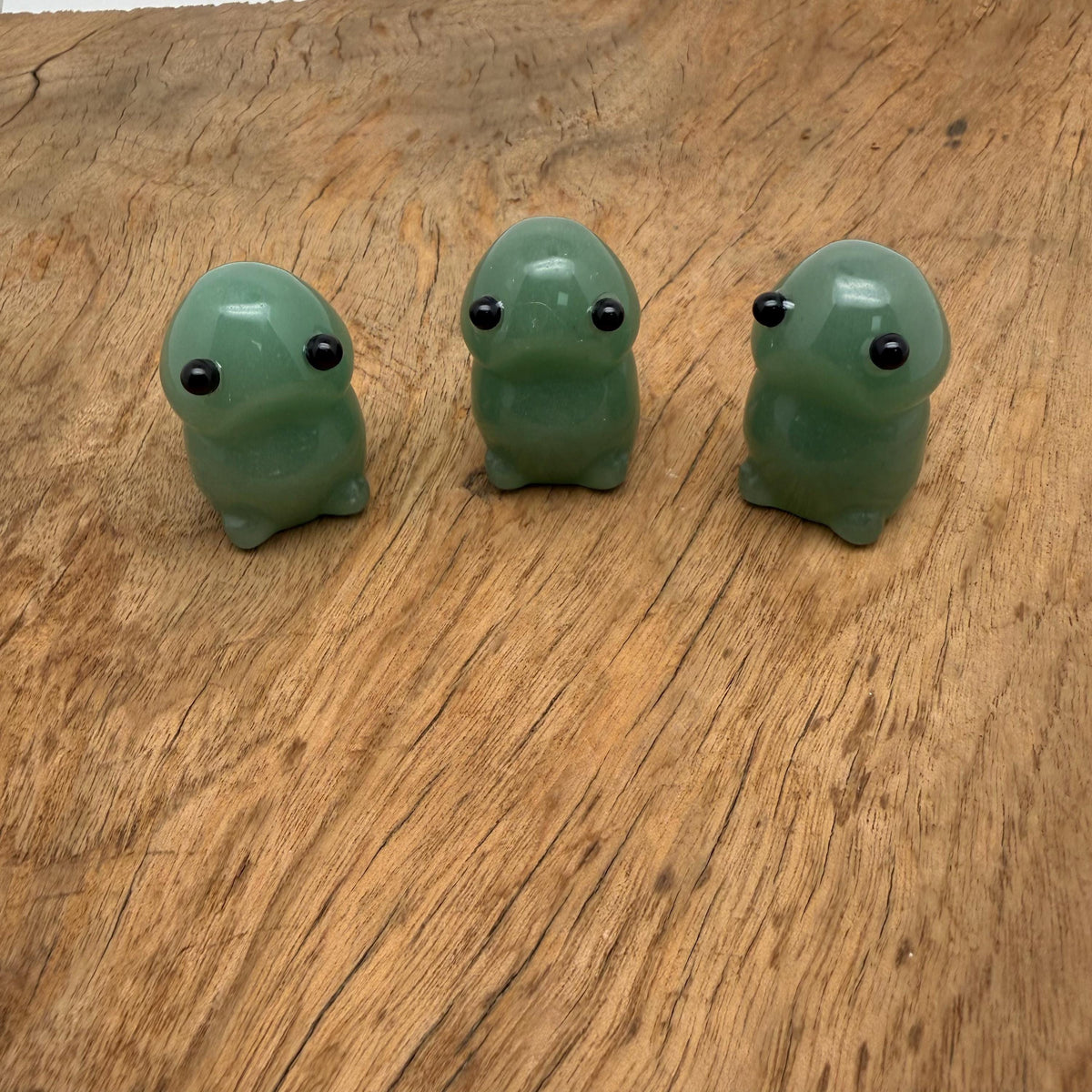 Handcrafted aventurine frog monster crystal carving with detailed gemstone features, gemstone sculpture, and vibrant green hues.