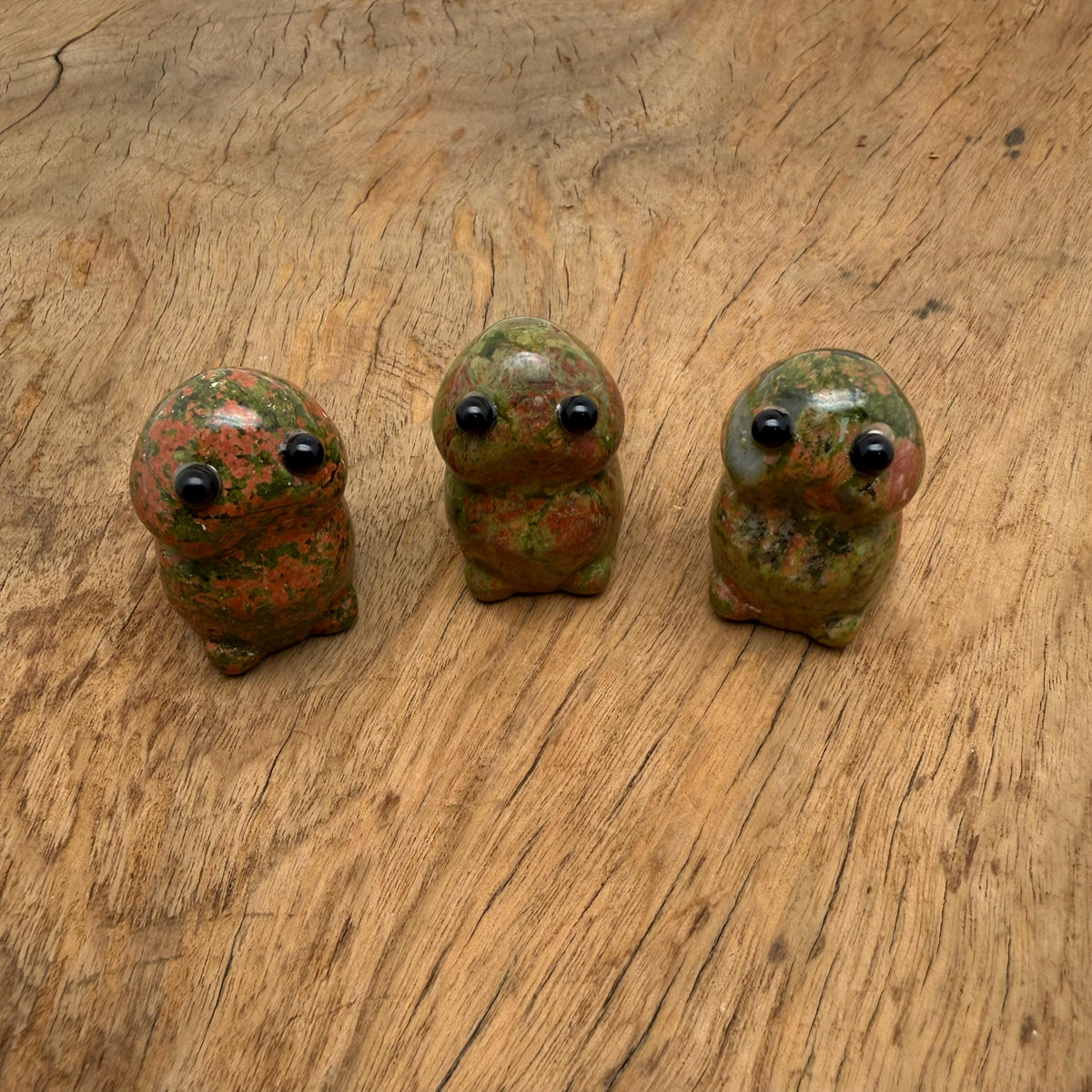 Handcrafted Unakite frog monster crystal carving by GemstoneGO, detailed gemstone creature statue with vibrant green and pink hues.