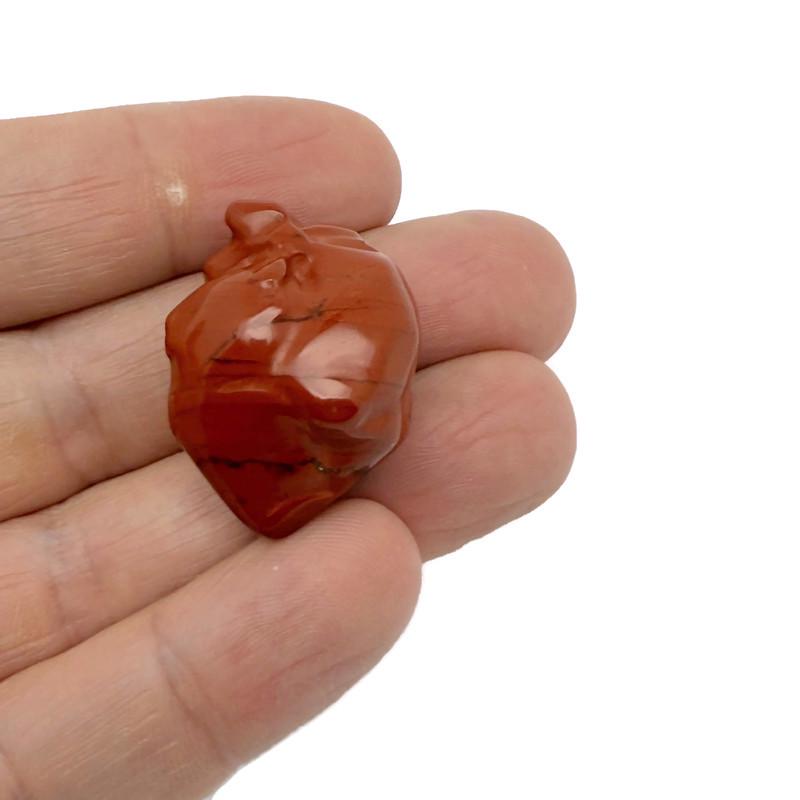 Handmade 30mm gemstone heart figure carved from crystal, displayed on a neutral background, by GemstoneGO.