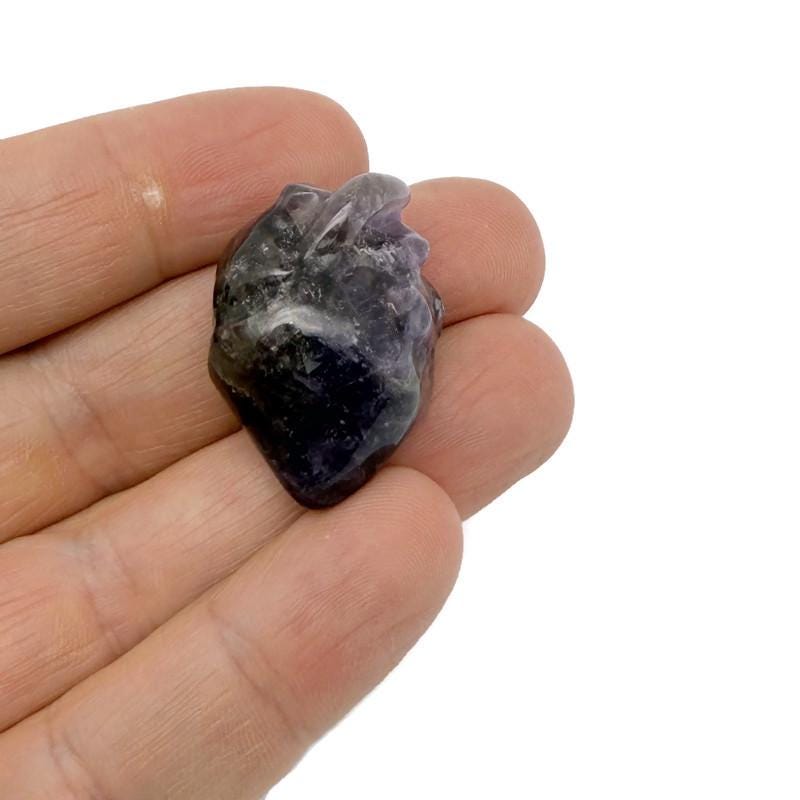 Handmade 30mm crystal heart figure carved with unique gemstone design by GemstoneGO, showcasing intricate craftsmanship.