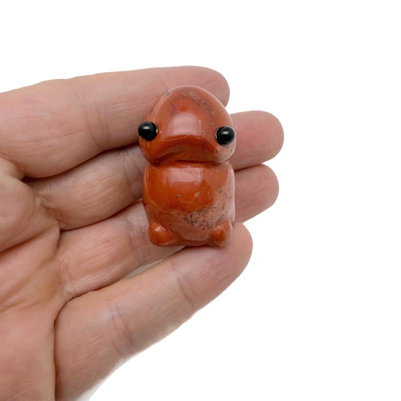 Red Jasper frog monster crystal carving by GemstoneGO, handcrafted gemstone creature statue with detailed features and vibrant red color.