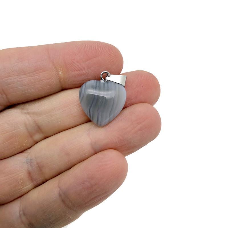 Grey agate heart pendant necklace featuring a mini crystal design from GemstoneGO, showcasing a polished stone with a silver bail.