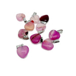 Pink agate heart pendant by GemstoneGO featuring a mini crystal design, showcasing a polished pink gemstone heart.