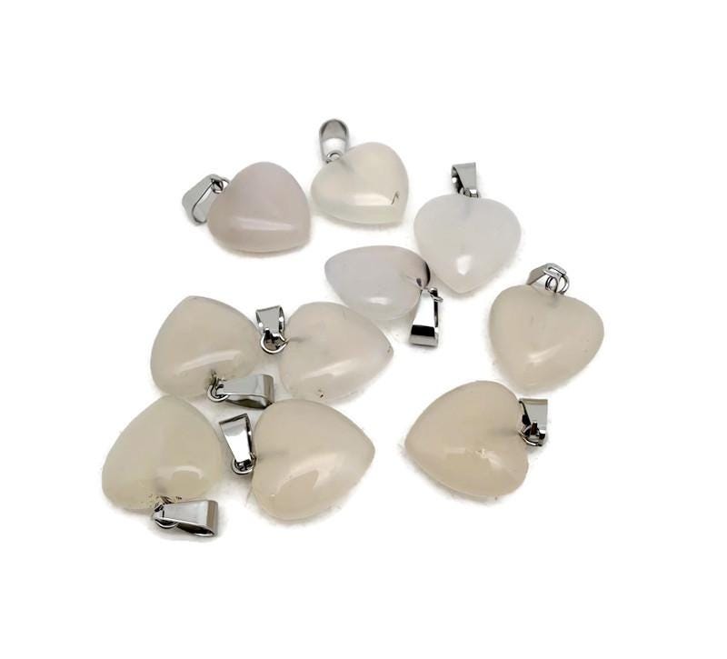White agate heart pendant from GemstoneGO featuring a mini crystal design, showcasing a polished, smooth gemstone with a delicate heart shape.