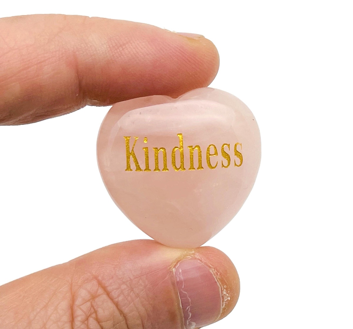 Rose quartz heart crystal engraved with symbols representing love, trust, strength, and happiness, by GemstoneGO.