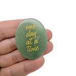 Engraved crystal with inspirational message "One Day at a Time" by GemstoneGO, featuring clear, polished gemstone with engraved text.