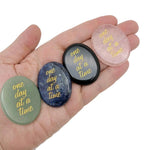 Engraved crystal with "One Day at a Time" motivational message from GemstoneGO, featuring a clear, polished gemstone with engraved text.