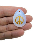 Crystal peace symbol engraved charm from GemstoneGO, drilled for positive energy, calm, and harmony.