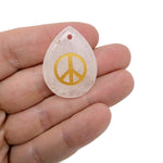 Crystal peace symbol engraved charm drilled for jewelry, promoting calm, harmony, and positive energy, by GemstoneGO.
