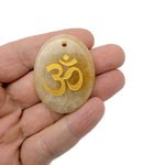 Drilled crystal pendant engraved with Om symbol, gemstone with spiritual Om symbol design for insight and guidance by GemstoneGO