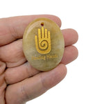Healing Hands engraved crystal amulet by GemstoneGO, drilled energy healer gift pendant with intricate design visible.